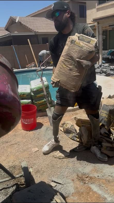 Vaquero X owner on the job carrying concrete